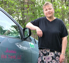 Mrs posing with her mini van.