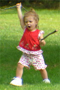 Our little granddaughter charging across the yard